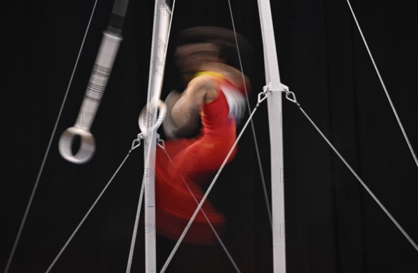 Gymnastics, artistic gymnastics, gymnasts, men, feature, movement, movement effect, wipe effect, rings, EnBW DTB-Pokal 2024, Porsche Arena, Stuttgart, Baden-Württemberg, Germany, Europe