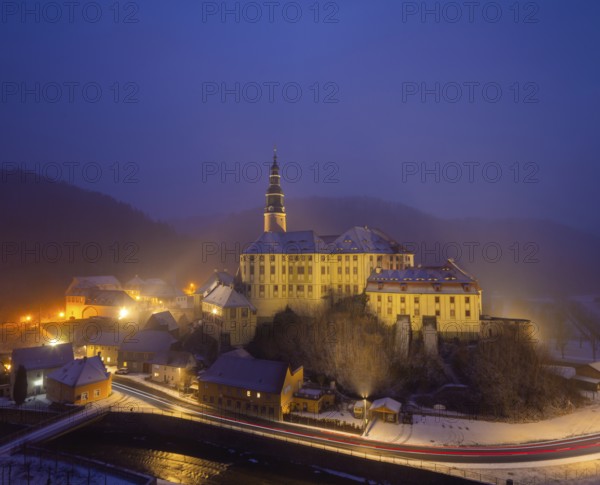 Winter evening in the Müglitz valley, impressively illuminated Weesenstein Castle at the blue hour, Weesenstein, Saxony, Germany, Europe