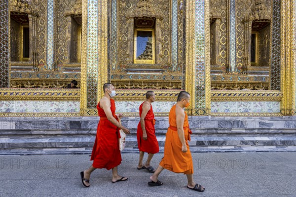 Wat Phra Kaeo temple, royal palace. Royal chapel with Buddhist monks and novices. Bangkok, Thailand, Asia