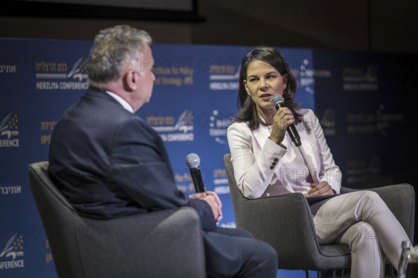 Annalena Bärbock (Alliance 90/The Greens), Federal Foreign Minister, photographed during her trip to Israel. Here taking part in the '21st Herzliya Conference, On the path of Strategic Surprises'. On stage with the former Israeli ambassador to the Federal Republic of Germany, Jeremy Issacharoff.