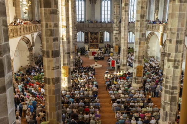 The so-called Bergstreittag is a beautiful centuries-old tradition and is celebrated on 22 July, the church memorial day and former feast day of Mary Magdalene in Schneeberg. The four quarterly sermons introduced in 1649 remained in place until 1845. These sermons were then abolished in favour of a single day, 22 July, which fell on Mary Magdalene. The Freiberg Mining Office recommended that this day should be celebrated with a festival and a mountain parade. In 1846, the Royal Ministry of Finance issued a decree to celebrate St Mary Magdalene's Day with a sermon and a magnificent mountain procession. The last major procession took place in July 1913. The First World War put an end to these processions. The tradition was not revived until July 1933, 528th Bergstreittag, church service in St Wolfgang's Church, Schneeberg, Saxony, Germany, Europe