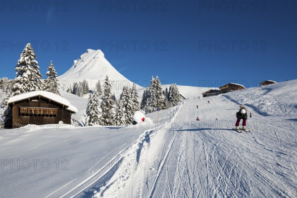 Snow-covered mountains and mountain hut with ski slope, Damülser Mittagspitze, Damüls, Bregenzerwald, Vorarlberg, Austria, Europe