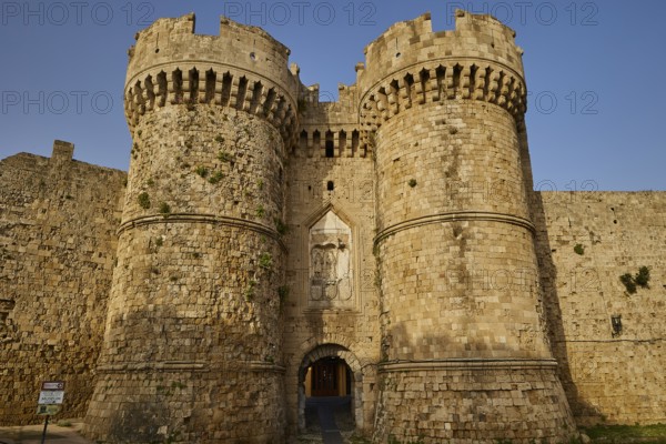 Old-fashioned entrance to a stone castle with tower and entrance gate, sea gate, harbour area, Rhodes Town, Rhodes, Dodecanese, Greek Islands, Greece, Europe