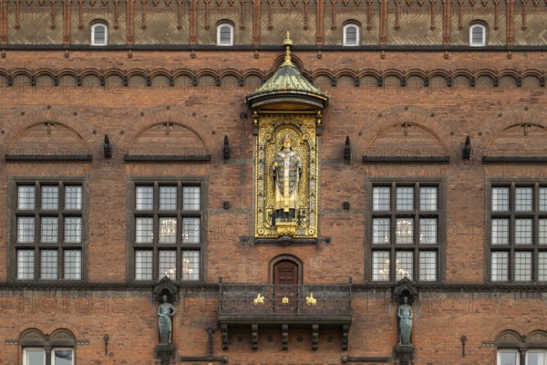 Brick façade with gilded sculpture of Bishop Absalon, Town Hall in the National Romantic style by Martin Nyrop, Town Hall Square, Rathausplatz or Rådhuspladsen, Copenhagen, Denmark, Europe