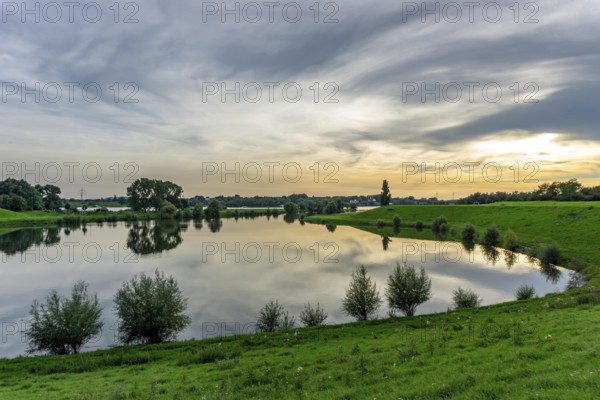 Lower Rhine landscape, reflection in the turning basin of the northern harbour of Walsum, view to the west, direction Orsory, North Rhine-Westphalia, Germany, Europe