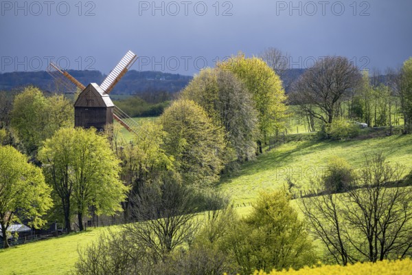 View over Breckerfeld, in the south-east of the Ruhr area, part of the Ennepe-Ruhr district, historic windmill in the Mühlenhof Breckerfeld, a small open-air museum, North Rhine-Westphalia, Germany, Europe