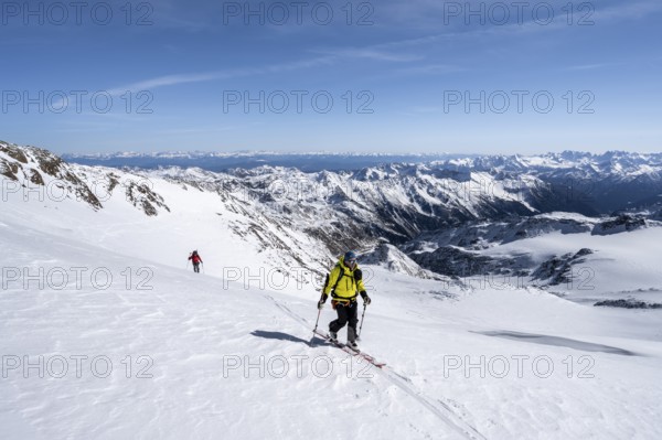 Ski tourers on the glacier, on the ascent to Monte Cevedale, mountain panorama, snow-covered mountain landscape in winter, view into the Martell Valley, high tour, Ortler Alps, Vinschgau Valley, Italy, Europe