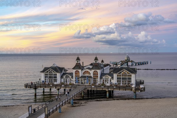 The pier of Sellin, evening mood, sunset, 394 metres long, with restaurant, jetty, beach chairs, island of Rügen, Mecklenburg-Western Pomerania, Germany, Europe