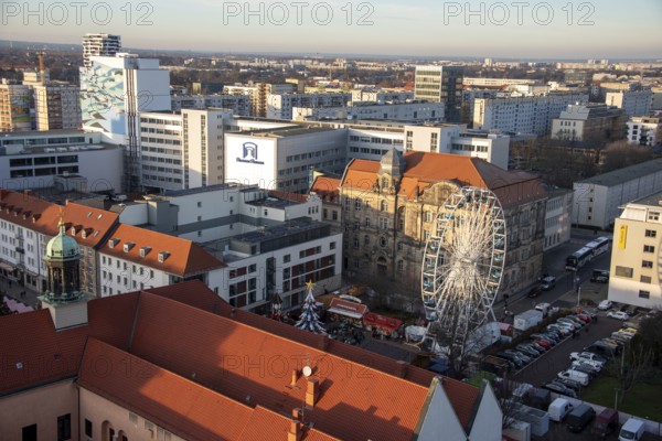 High-rise buildings in the city centre with Ferris wheel at the Christmas market, Magdeburg, Saxony-Anhalt, Germany, Europe