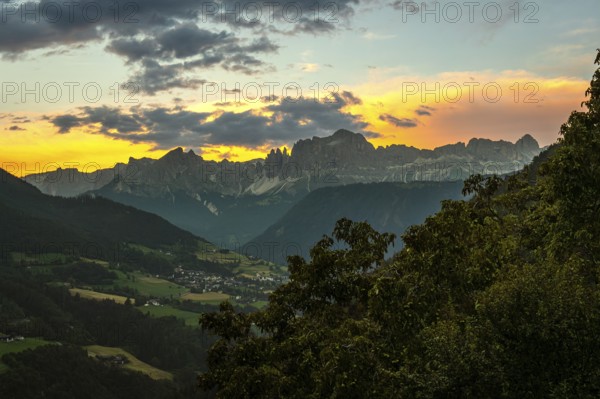 Stunning sunset over the italian dolomites, creating a breathtaking panorama of vibrant colors, rugged peaks, and lush valleys