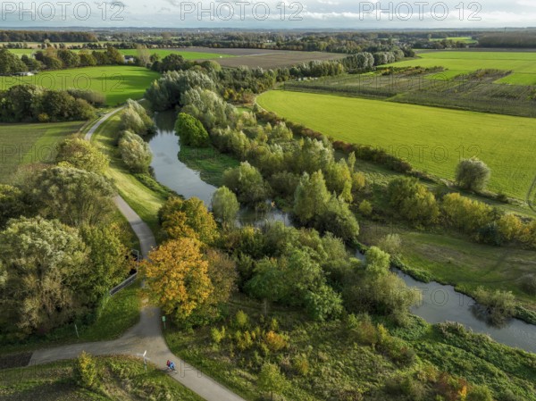 Bergkamen, Ruhr area, North Rhine-Westphalia, Germany, autumn landscape on the Seseke. The renaturalised Seseke, a tributary of the Lippe, has been transformed into a near-natural watercourse, flood protection and biodiversity through newly designed floodplains. Following the construction of a parallel sewer, the Seseke is now free of wastewater, having previously been an open, above-ground wastewater sewer, combined sewer with surface water and wastewater. Theme photo: EU Nature Conservation Act. The EU Nature Conservation Act obliges member states to implement measures to restore nature on at least 20 per cent of the EU's land and sea areas by 2030, Europe