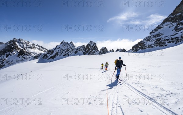 Ski tourer with rope, rope team on the Vadret da Porchabella glacier on the ascent to the summit of Piz Kesch, mountain landscape in winter, alpine tour, ski tour Bündner Haute Route, Albula Alps, Rhaetian Alps, Grisons, Eastern Switzerland, Switzerland, Europe