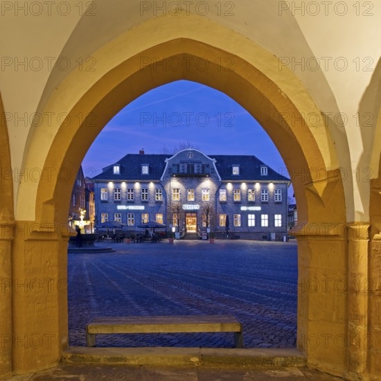 View from the open hall of the late Gothic town hall in Goslar in the evening onto the market square with the Kaiserringhaus, UNESCO World Heritage Site, Lower Saxony, Germany, Europe