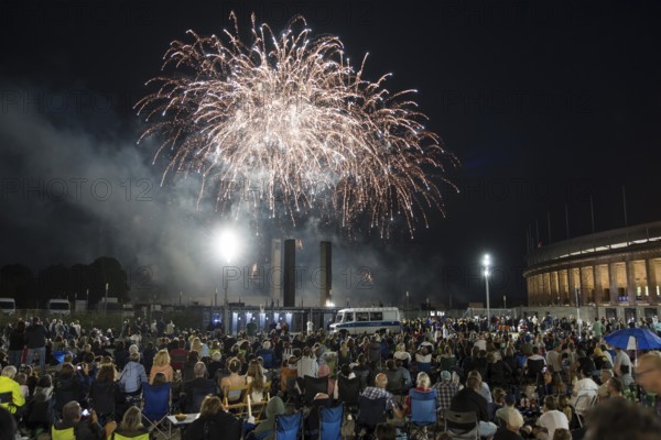 Spectators watch the fireworks at the Pyronale on the Maifeld at the Olympic Stadium, Berlin, 30/08/2024