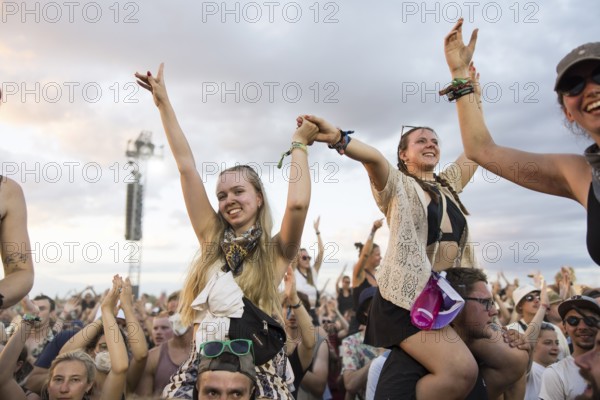 Festival visitors are carried on shoulders during the performance of the band Feine Sahne Fischfilet at the Highfield Festival on Saturday, Störmthaler See, 17/08/2024