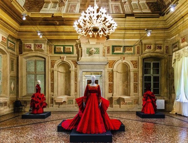 Red silk Mikado wedding dress in various shades of red with embroidered bodice, 2009, exhibition of magnificent evening dress creations by fashion designer Roberto Capucci, 17th century Villa Manin, residence of Ludovico Manin, Codroipo, Friuli, Italy, Codroipo, Friuli, Italy, Europe