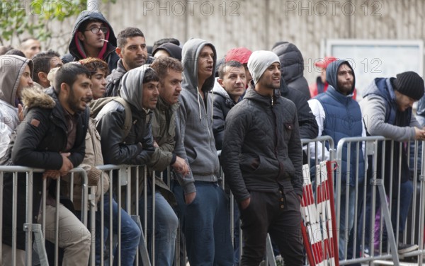 Refugees from Syria waiting to be registered at the Central Reception Centre for Asylum Seekers at the Berlin State Office for Health and Social Affairs, 09.10.2015