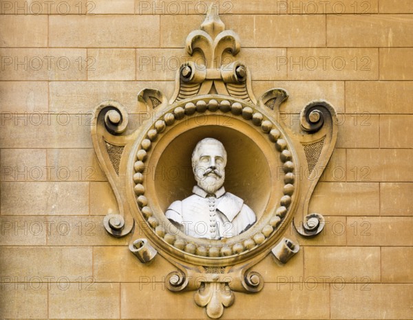 Holford family bust portrait in wall of Westonbirt House and School, Tetbury, Gloucestershire, England, UK