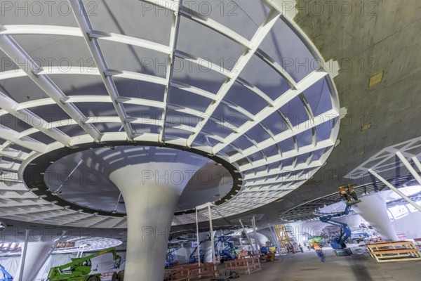 Impressions of the new Stuttgart 21 main station. The shell is finished, now it's time for the technical equipment. The 28 chalice-shaped columns supporting the roof of the underground through station are striking. Skylights with a diameter of around 21 metres provide daylight in the station. Stuttgart, Baden-Württemberg, Germany, Europe