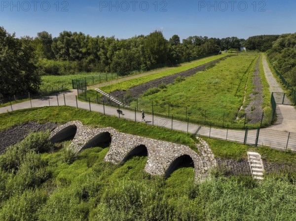 Bottrop-Gladbeck, North Rhine-Westphalia, Germany, Stormwater overflow basin, Stormwater retention basin, Renaturalised Boye, the tributary of the Emscher, was transformed into a near-natural watercourse, flood protection and biodiversity through newly designed floodplains. Following the construction of a parallel sewer, the Boye is now free of wastewater, is part of the Emscher river system and thus part of the Emscher reorganisation, was previously an open, above-ground wastewater sewer, combined sewer with surface water and wastewater, Europe