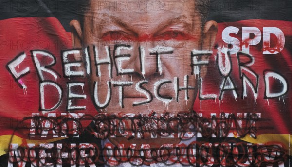 Denigration of a large poster for the 2025 federal election by the SPD with Olaf Scholz, Witten, North Rhine-Westphalia, Germany, Europe