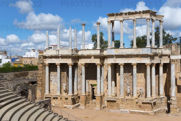 Ancient Roman theatre with columns and stairs, in the background a modern city under a blue sky, Teatro Romano de Mérida, Roman theatre of Merida, Merida, Badajoz, Extremadura, Spain, UNESCO World Heritage Site, Europe