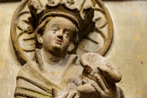 Mother of God with baby Jesus without head, detail of a damaged stone relief of a group of three, Severikirche in Erfurt, Thuringia, Germany, for editorial use only, Europe