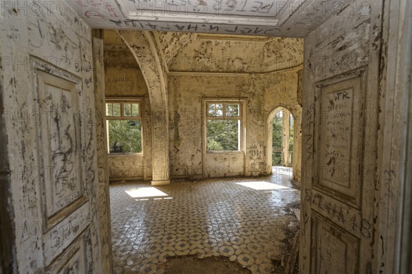 Dilapidated room with decorated tiles, open windows and arched doorway, showing a ruined structure inside, Mussolini Villa, Villa de Vecchi, Profitis Ilias, Empona, Rhodes, Dodecanese, Greek Islands, Greece, Europe