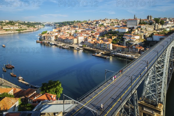 View of Porto city and Douro river and Dom Luis bridge I from famous tourist viewpoint Miradouro da Serra do Pilar on sunset. Porto, Vila Nova de Gaia, Portugal, Europe