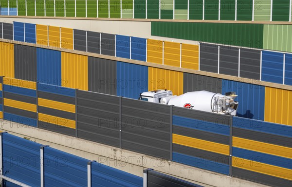 Colourful noise barriers on the A52 motorway, at the Essen-Rüttenscheid junction, the noise barriers were rebuilt in a colourful design as part of the motorway renovation, North Rhine-Westphalia, Germany, Europe
