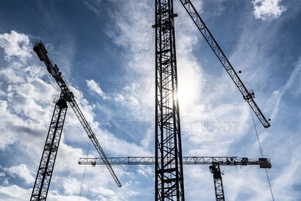 Construction cranes on two large construction sites, construction of office buildings in Dortmund-Schüren-Neu, North Rhine-Westphalia, Germany, Europe