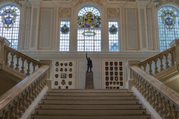 Elegant interior with majestic staircase, statue and stained glass windows, Belfast