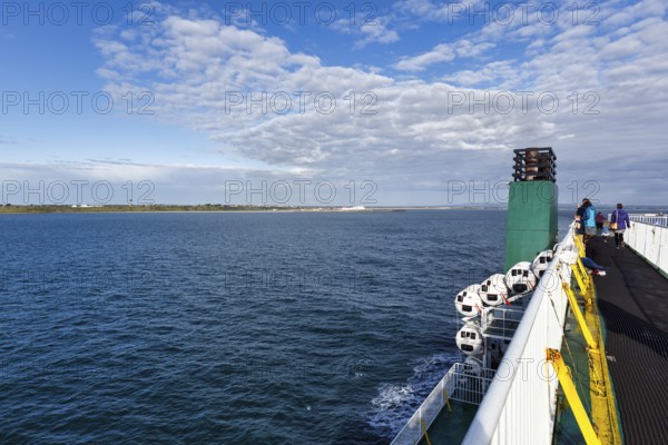 Passengers on a ferry between Ireland and Wales, view of the sea and coastline, spring clouds, Rosslare Harbour, Wexford, Ireland, Europe