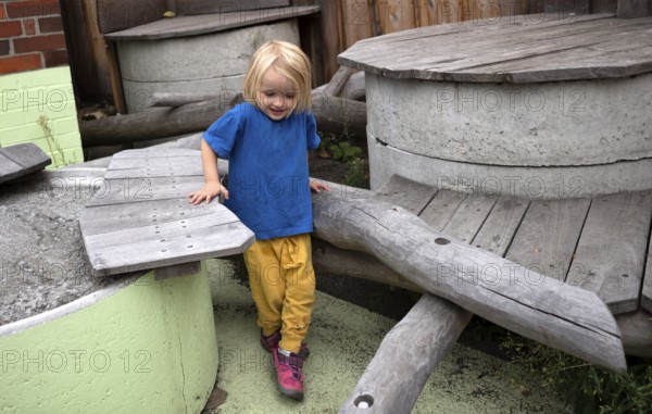 Little girl, 3 years, blonde, balancing, gymnastics, playing, adventure playground, playground, Stuttgart, Baden-Württemberg, Germany, Europe