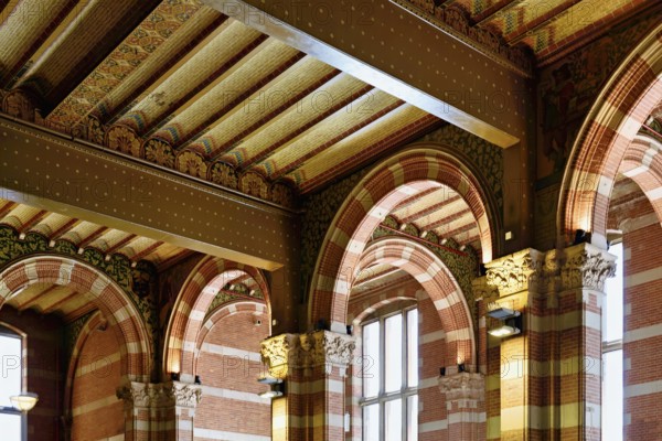Interior view of Centraal Station, Central Station with flag, Amsterdam, Netherlands