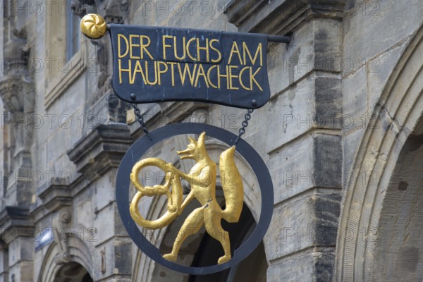 Figure of a fox with a pretzel, nose sign of a bakery, Hauptwachstr. 13, Bamberg, Upper Franconia, Bavaria, Germany, Europe