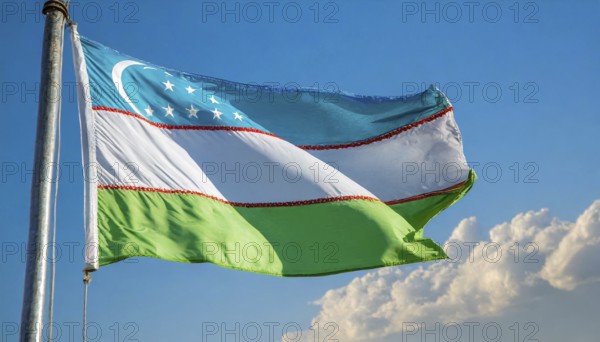 Flags, the national flag of Uzbekistan flutters in the wind
