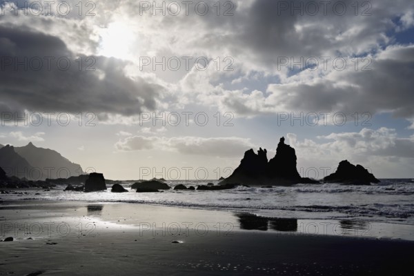 Dramatic clouds with rock formation on the beach of Playa de Benijo, Tenerife, Canary Island, Spain, Europe