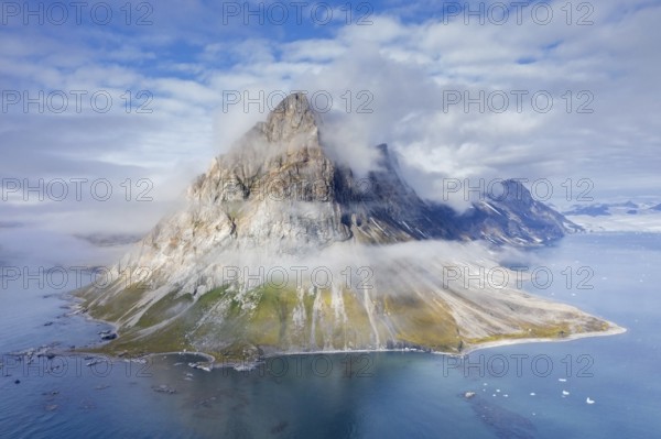 Gnalberget, mountain with steep sea cliffs in Hornsund fjord at Gnålodden in summer, Svalbard, Spitsbergen, Norway, Europe