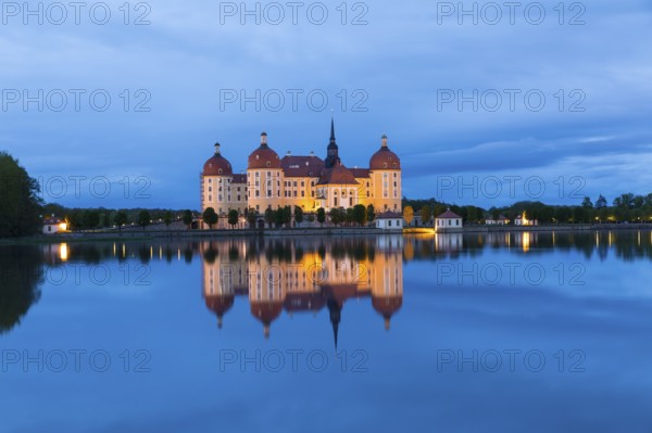 Moritzburg Hunting Lodge with reflection in the castle pond in the evening, Moritzburg, Saxony, Germany, Europe