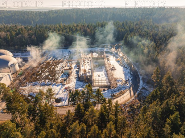 Snow-covered building site next to domed buildings, surrounded by forest, new fire station, Oberhaugsett, district of Calw, Germany, Europe