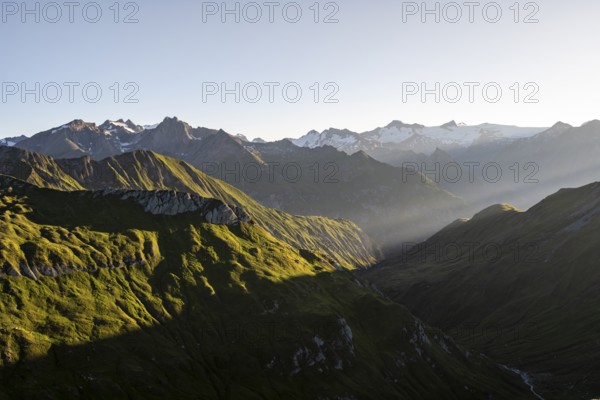 Mountain landscape at sunrise, view of mountain peaks of the Venediger group and into the Großbachtal valley from the summit of Bachlenkenkopf, Lasörling group, Hohe Tauern National Park, East Tyrol, Tyrol, Austria, Europe