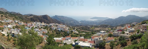 Panoramic view of the village of Othos, mountains and sea under a blue sky, hike from Pyles to Othos, Pyles, Othos, Karpathos, Greece, Europe