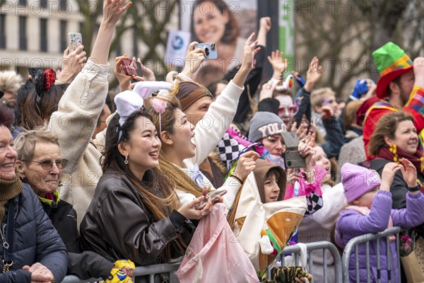 Rose Monday parade in Düsseldorf, Asian spectators, at the street carnival, here Fortuna Düsseldorf, fan groups, North Rhine-Westphalia, Germany, Europe