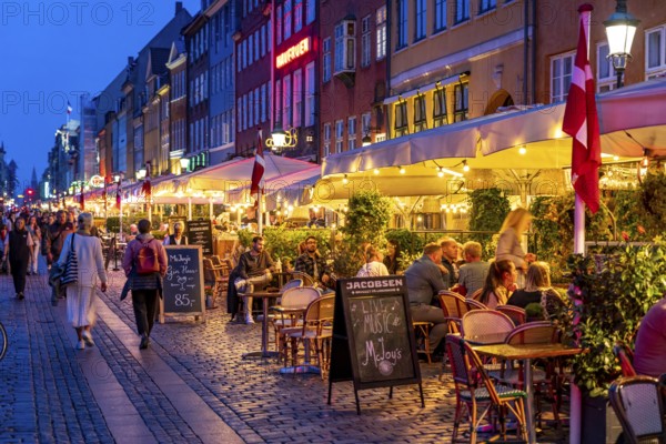 Nyhavn, in the Frederiksstaden district, in the evening, harbour district with houses over 300 years old, promenade with many cafés, pubs, restaurants, canal, tourist attraction, Copenhagen, Denmark, Europe