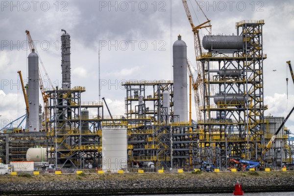 New building, construction site, of a bio-refinery of the Finnish oil company Neste, here, among other things, sustainable bio aviation fuels are to be produced, construction site in the harbour Maasvlakte 2, in Rotterdam, Netherlands