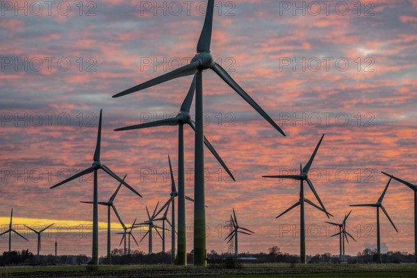 Wind farm near the East Frisian town of Norden, east of the town, sunset, Lower Saxony, Germany, Europe