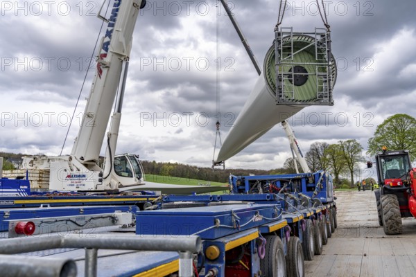 Preparation for the transport of a 68 metre long blade, a wind turbine, with a self-propelled Blade-Lifter vehicle, over a 40 km long route in the Bergisches Land, through towns, villages, over country roads, narrow through roads, to the construction site of the wind turbine near Hagen, North Rhine-Westphalia, Germany, Europe