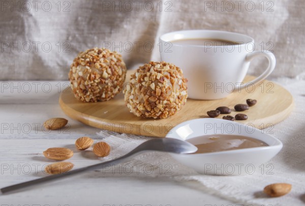 Energy balls cakes with nuts on wooden board on linen napkin. selective focus, close up