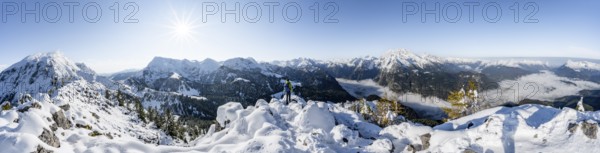Panorama, mountaineer on the snowy summit of the Jenner in autumn, view of the sea of clouds and Hagengebirge and Watzmann, Sonnenstern, Berchtesgaden National Park, Berchtesgaden Alps, Schönau am Königssee, Berchtesgadener Land, Bavaria, Germany, Europe